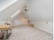 Finished Bonus Room featuring large windows, skylights, carpet, and attic access at 125 Cherokee Dr, Mooresville, NC 28117