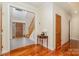 Inviting foyer features hardwood floors, a staircase, and a stylish entryway with a decorative glass door at 125 Cherokee Dr, Mooresville, NC 28117