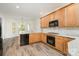 Updated kitchen with granite countertops, stainless steel appliances, and wood cabinets at 125 Cherokee Dr, Mooresville, NC 28117