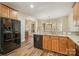 Well-equipped kitchen with granite countertops, stainless steel appliances, and wood cabinets at 125 Cherokee Dr, Mooresville, NC 28117