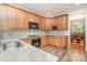 Updated kitchen with granite countertops, stainless steel appliances, and wood cabinets at 125 Cherokee Dr, Mooresville, NC 28117