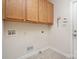 Practical laundry room with overhead cabinets and utility connections, ready for appliances and ease of use at 125 Cherokee Dr, Mooresville, NC 28117