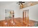 Spacious living room with hardwood flooring and entry to kitchen and dining room at 125 Cherokee Dr, Mooresville, NC 28117