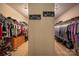 Custom walk-in closets, neatly organized, feature built-in drawers and ample hanging space, ensuring style and organization at 15309 Guthrie Dr, Huntersville, NC 28078