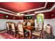 Elegant dining room featuring wood table, chairs, custom paint and trim detail at 15309 Guthrie Dr, Huntersville, NC 28078