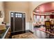 Spacious foyer with dark wood floors leading to a dining area at 15309 Guthrie Dr, Huntersville, NC 28078