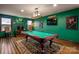 Finished basement game room featuring a pool table, bar, and a custom lighting, perfect for entertaining or relaxing at 15309 Guthrie Dr, Huntersville, NC 28078