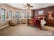 A serene main bedroom with a unique trey ceiling boasts large windows and a comfortable sitting area at 15309 Guthrie Dr, Huntersville, NC 28078