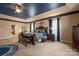Primary bedroom with a ceiling fan, lots of natural light, and elegant furniture at 15309 Guthrie Dr, Huntersville, NC 28078