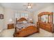 Bedroom featuring a decorative wood bed frame, natural light and wooden dressers at 15326 Coventry Court Ln, Charlotte, NC 28277