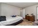 This bedroom features light walls, wood floors, and a traditional wooden dresser at 1645 Stony Point Rd, Shelby, NC 28150