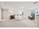 Bright and airy main bedroom suite with neutral tones and ample natural light from large windows at 16831 Cozy Cove Rd, Charlotte, NC 28278