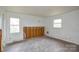 Bedroom with two windows for natural light, revealing some exposed wall framework at 1711 Brookdale Ave, Charlotte, NC 28210