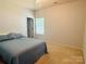 Clean bedroom with carpet floors, a window and an ensuite bathroom at 1726 Still River Way, Fort Mill, SC 29708