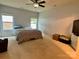 Spacious carpeted bedroom features ample natural light and a ceiling fan at 1726 Still River Way, Fort Mill, SC 29708
