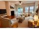 Bright and airy living room featuring a fireplace, large windows, and access to an outdoor patio at 1726 Still River Way, Fort Mill, SC 29708