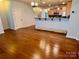 An open-concept living space with hardwood floors, a doorway, and open access to the kitchen at 1726 Still River Way, Fort Mill, SC 29708