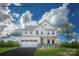 Charming two-story home featuring a two-car garage, light-colored exterior, and beautifully landscaped front yard at 1813 Ab Moore Jr Dr # 3239, Indian Trail, NC 28079