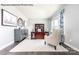 Bright office featuring hardwood floors, a large desk, stylish decor, and ample natural light from the window at 1813 Ab Moore Jr Dr # 3239, Indian Trail, NC 28079