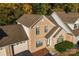 Aerial view of a brick townhouse highlighting the roof, landscaping, and attached garage at 200 W 18Th St, Newton, NC 28658