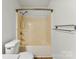 Bathroom with a neutral-colored bathtub and shower combination with white toilet and walls at 200 W 18Th St, Newton, NC 28658