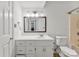 Bathroom featuring a vanity with storage, a large mirror, and a toilet at 200 W 18Th St, Newton, NC 28658