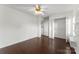 Bright bedroom with hardwood floors, white walls, closet, and ceiling fan at 200 W 18Th St, Newton, NC 28658