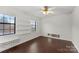 Bedroom featuring hardwood floors, white walls, and natural light from windows at 200 W 18Th St, Newton, NC 28658