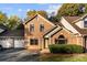Charming brick townhouse featuring a well-maintained lawn, attached garage, and inviting entryway at 200 W 18Th St, Newton, NC 28658