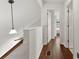 Hallway featuring hardwood floors, white walls, and an open doorway to another room at 200 W 18Th St, Newton, NC 28658