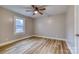 Bedroom with light walls, laminate flooring and a ceiling fan at 2625 20Th Ne St, Hickory, NC 28601