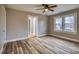 Bedroom with neutral walls, wood-look flooring, a ceiling fan, and windows to provide natural light at 2625 20Th Ne St, Hickory, NC 28601