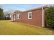 Side view of a brick home with white trimmed windows and front door at 2625 20Th Ne St, Hickory, NC 28601