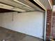 Spacious garage interior with a painted brick and cinderblock wall at 2625 20Th Ne St, Hickory, NC 28601