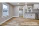 Kitchen boasts modern white cabinets, granite countertops, stainless appliances, and wood-look floors at 2625 20Th Ne St, Hickory, NC 28601