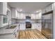 Modern kitchen with stainless steel appliances, granite countertops, and white cabinetry at 2625 20Th Ne St, Hickory, NC 28601