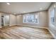 Bright living room with laminate floors, neutral paint and large windows at 2625 20Th Ne St, Hickory, NC 28601