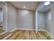 A spacious living room with wood-look flooring and white trim work and a ceiling light at 2625 20Th Ne St, Hickory, NC 28601