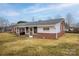 Cozy home featuring a screened porch, brick accents, and a well-maintained lawn for outdoor enjoyment at 2625 20Th Ne St, Hickory, NC 28601