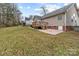 Spacious backyard featuring a well-maintained lawn, deck, and a gravel area at 2801 Parkwest Dr, Albemarle, NC 28001