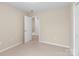 Neutral-toned bedroom with plush carpeting, closet, a door and serene space at 2801 Parkwest Dr, Albemarle, NC 28001