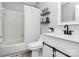 Clean bathroom featuring tile floors, a modern vanity, and a shower with a white curtain at 2900 Heathstead Pl # H, Charlotte, NC 28210
