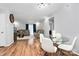Spacious living room featuring a glass table and adjacent dining room at 2900 Heathstead Pl # H, Charlotte, NC 28210