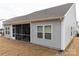 Spacious backyard with a screened-in porch perfect for outdoor relaxation at 3156 Pinehills Way, Mount Holly, NC 28120