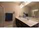Bright bathroom with double vanity, modern faucets, and framed mirror at 3156 Pinehills Way, Mount Holly, NC 28120