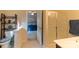 Well-lit bathroom with a glass enclosed shower and a glimpse into the main bedroom at 3156 Pinehills Way, Mount Holly, NC 28120