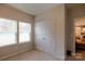 Cozy bedroom with natural light from two windows and a convenient closet at 3156 Pinehills Way, Mount Holly, NC 28120