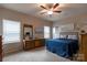 Comfortable bedroom with natural light, dresser, mirror and stylish decor at 3156 Pinehills Way, Mount Holly, NC 28120