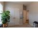 Hallway with double doors, neutral paint, leading to another room in the home at 3156 Pinehills Way, Mount Holly, NC 28120