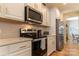 Well-equipped kitchen featuring stainless steel appliances, white cabinets, and quartz countertops at 3156 Pinehills Way, Mount Holly, NC 28120